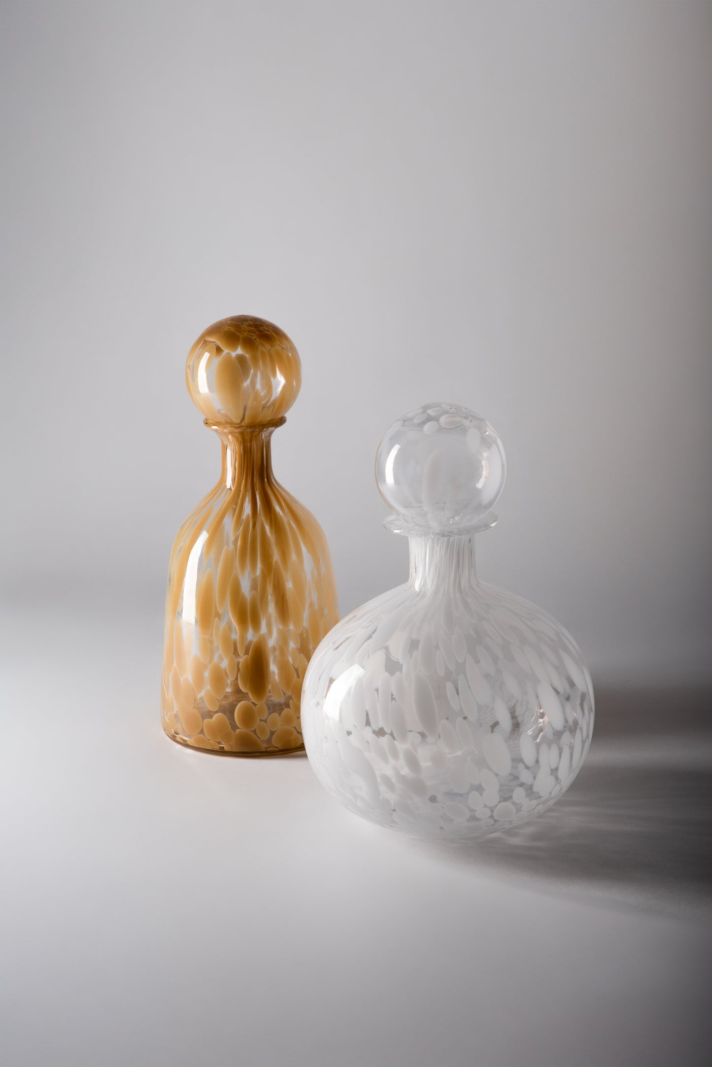 Beige and White Glass Bottles
